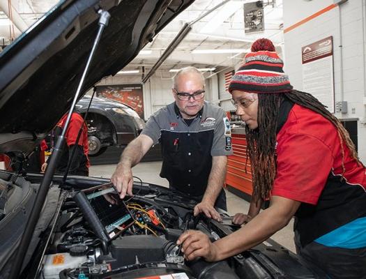 Automotive student looks under the hood